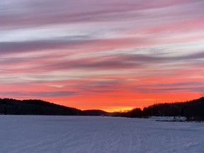 Colours from a painter's palette glows at the west end of McCharles Lake in Naughton, Ont. on Friday January 8, 2021.