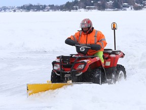 A work crew was busy clearing snow off Ramsey Lake for the skating path in Sudbury, Ont. on Monday January 11, 2021.