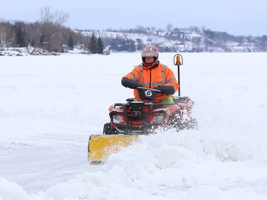 A work crew was busy clearing snow off Ramsey Lake for the skating path in Sudbury, Ont. on Monday January 11, 2021. John Lappa/Sudbury Star/Postmedia Network