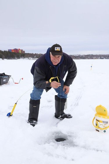 Rolly Rousseau took advantage of the mild temperatures and went ice fishing on Ramsey Lake in Sudbury, Ont. on Tuesday January 12, 2021. John Lappa/Sudbury Star/Postmedia Network