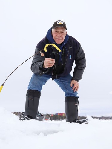 Rolly Rousseau took advantage of the mild temperatures and went ice fishing on Ramsey Lake in Sudbury, Ont. on Tuesday January 12, 2021.