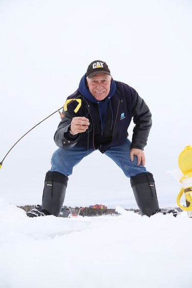 Rolly Rousseau took advantage of the mild temperatures and went ice fishing on Ramsey Lake in Sudbury, Ont. on Tuesday January 12, 2021. John Lappa/Sudbury Star/Postmedia Network