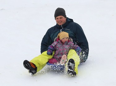 Thierry Middleton goes sliding with his daughter, Lilia, 2, in Sudbury, Ont. on Wednesday January 13, 2021. John Lappa/Sudbury Star/Postmedia Network