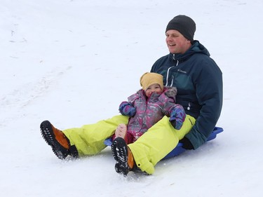 Thierry Middleton goes sliding with his daughter, Lilia, 2, in Sudbury, Ont. on Wednesday January 13, 2021. John Lappa/Sudbury Star/Postmedia Network