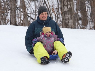 Thierry Middleton goes sliding with his daughter, Lilia, 2, in Sudbury, Ont. on Wednesday January 13, 2021. John Lappa/Sudbury Star/Postmedia Network