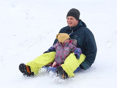Thierry Middleton goes sliding with his daughter, Lilia, 2, in Sudbury, Ont. on Wednesday January 13, 2021. John Lappa/Sudbury Star/Postmedia Network