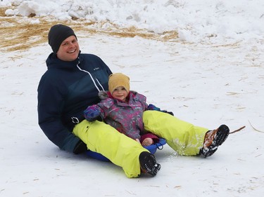 Thierry Middleton goes sliding with his daughter, Lilia, 2, in Sudbury, Ont. on Wednesday January 13, 2021. John Lappa/Sudbury Star/Postmedia Network