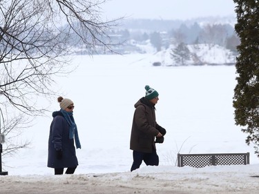 People go for a stroll through Bell Park in Sudbury, Ont. on Wednesday January 13, 2021. John Lappa/Sudbury Star/Postmedia Network