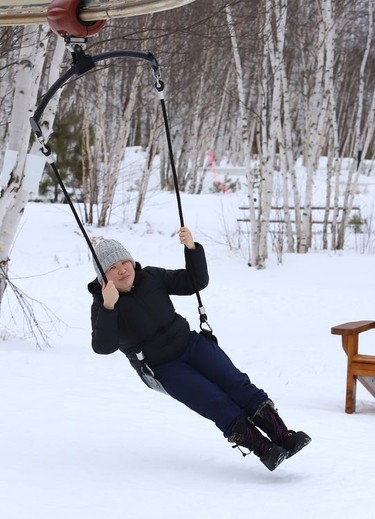 Irene Zhu enjoys a zip line ride at Kivi Park in Sudbury, Ont. on Thursday January 14, 2021. John Lappa/Sudbury Star/Postmedia Network