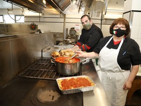 Head chef Irene Costantini and Mike Baricelli prepare an order at the Caruso Club in Sudbury, Ont. on Tuesday January 19, 2021. The Societa Caruso Culture and Education Committee is offering a fettuccine and chicken dinner at the Caruso Club on January 30, 2021. Take out is being offered from 3 p.m. to 6 p.m. The meal includes fettuccine with meat sauce, roasted chicken and buns. A single portion is $15, and family style, which serves four, is $45. To place an order, call 705-675-1357.