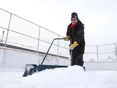 Vic Desormeaux clears snow off the rink at Antwerp Playground in Sudbury, Ont. for flooding on Tuesday January 19, 2021. John Lappa/Sudbury Star/Postmedia Network