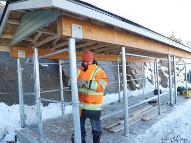 Jay Harvey, of Point North Fence, attaches mechanisms for a fence that will be installed for a new outdoor kennel at the Ontario SPCA Sudbury and District Animal Centre in Sudbury, Ont. on Thursday January 28, 2021. John Lappa/Sudbury Star/Postmedia Network