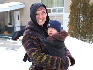 Melody Wolfe goes for a walk with her son Callan, 15 months, strapped to her front in Sudbury, Ont. on Friday January 29, 2021. John Lappa/Sudbury Star/Postmedia Network