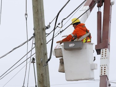 A hydro crew was called in to replace a hydro pole at Webbwood Drive and Lorne Street in Sudbury, Ont. on Friday January 29, 2021. The pole was damaged as a result of a motor vehicle collision. About 460 hydro customers were without power for about 11 hours. John Lappa/Sudbury Star/Postmedia Network