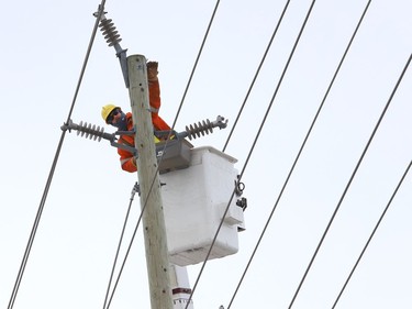 A hydro crew was called in to replace a hydro pole at Webbwood Drive and Lorne Street in Sudbury, Ont. on Friday January 29, 2021. The pole was damaged as a result of a motor vehicle collision. About 460 hydro customers were without power for about 11 hours. John Lappa/Sudbury Star/Postmedia Network