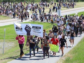 Hundreds of people march in the Black Lives Matter: Juneteenth Racial Injustice Rally in Sudbury, Ont. on Friday June 19, 2020.