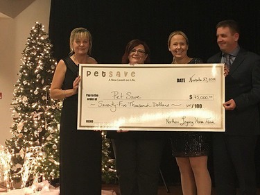 Craig Fielding, far right, and Katriina Ruotsalo of Northern Legacy Horse Farm present a cheque worth $75,000 to Jill Pessot, far left, and Andrea Krats of Pet Save. Supplied