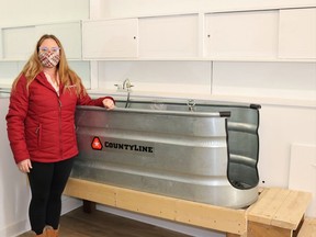 Cassie Dalgety stands next to the bathing station at her dog grooming business, Cassie's Dog Spa. Carl Hnatyshyn/Sarnia This Week