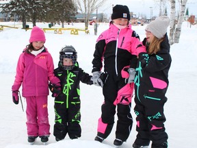 Abby Breton, from right, was skating with her sisters, Aleigha, Tatum and Avery Norkum, on a mild Tuesday afternoon at the Hollinger Skating Path. Daytime temperatures in Timmins are expected to drop into the mid-teens over the next two days and then warm up with sunshine on the weekend.