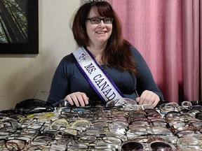 Sammy Barrette shows off the nearly two hundred pairs of glasses that will go to people who can't afford a pair..TP.jpg
