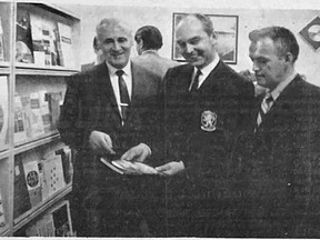 Information unlimited – Honourable Rene Brunelle (centre), Minister of Lands and Forests who officially opened the Northern Affairs Office in Cochrane, examines of of the many information booklets available at the office. With him are Mayor Maurice Hotte (left) and Northern Affairs officer  George Rhodes. Archive photo