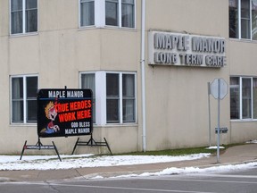 A sign outside the hard-hit Maple Manor nursing home in Tillsonburg reads "TRUE HEROES WORK HERE." (Chris Abbott/Postmedia Network)