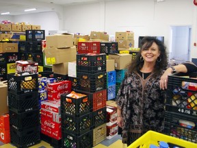 Karen McDade, St. Thomas-Elgin Food Bank general manager, poses in the new space for the former Caring Cupboard, opening Monday on the main floor of the Royal Canadian Legion Lord Elgin Branch 41 building. (Eric Bunnell photo)