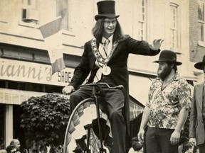 St. Marys Mayor Al Strathdee recreates a photo of then-mayor Clifton Brown on his Penny Farthing bicycle during the 1978 Homecoming Parade. In the background of both photos is St. Marys resident Bob Doupe. (Photos courtesy the St. Marys Museum and Archives)