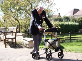 Retired British Army Captain Tom Moore, 99, walks to raise money for health workers, by attempting to walk the length of his garden one hundred times before his 100th birthday this month as the spread of coronavirus disease (COVID-19) continues, Marston Moretaine, Britain, April 15, 2020. REUTERS/Peter Cziborra)