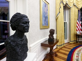 Busts of civil rights leader Rosa Parks and President Abraham Lincoln decorate the Oval Office as decorated for newly-inaugurated President Joe Biden at the White House in Washington, U.S. January 21, 2021.  REUTERS/Jonathan Ernst