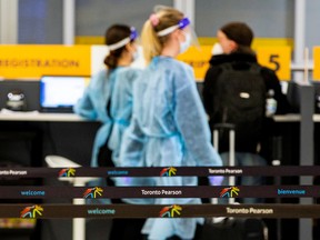 Passengers arrive at Toronto's Pearson airport after mandatory coronavirus disease  testing took effect for international arrivals Monday. REUTERS/Carlos Osorio