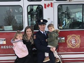 Pictured with his family, which he will have no personal contact with for longer than the actual length of the event, Strathcona County firefighter Andrew Buchanan is one of three-quarters of the list of newcomers taking part in the seventh staging of the World's Longest Hockey Game. Photo supplied