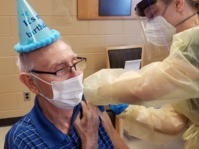 Earl Morrison received the second dose of the COVID-19 vaccine at PeopleCare Tavistock on Feb. 2, celebrating his 95th birthday a day early. Morrison was also the first long-term care home resident in the region to receive the COVID-19 vaccine. (Submitted)