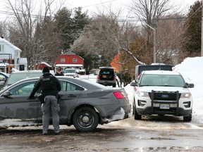 Police are seen at a home on Passmore Avenue, Saturday afternoon, to search for possible explosives. One male has since been taken into custody. Michael Lee/The Nugget