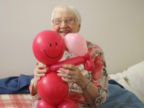 Marie Cyr, who lives at Greenwood Court, is one of the many long-term care and retirement home residents in Stratford who have received a "balloon buddy" from ballon artist Melanie Bonaventura. Bonaventura, with the support of sponsors, is attempting to make one for every long-term care and retirment home resident in Stratford. (Contributed photo)