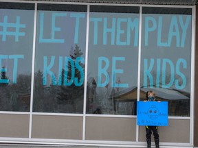 Jacoby Kilburn outside the Cheer Force Jets gym on Jan. 30 before a Let Them Play parade to protest Alberta's ban on youth sports.