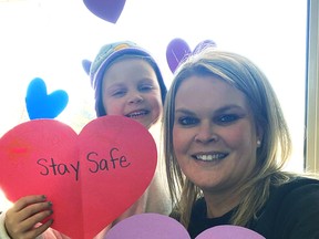 Pam Zeehuisen poses with daughter Ella Zeehuisen showing off some of the hearts they created to raise donations for Seaforth Manor, the latest regional long-term care and retirement home hit hard by the coronavirus. SUBMITTED