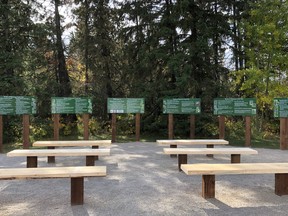 The new outdoor classroom in Pipestone Park, with signs picturing and describing native plants.