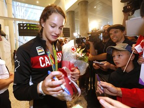 Gold medal winning swimmer Penny Oleksiak arrives at Pearson on a flight from Rio on Tuesday August 23, 2016.