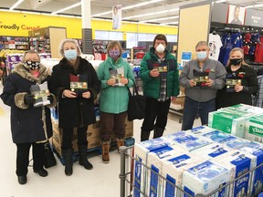 Espanola Helping Hand Food Bank volunteers Bernie Houle, Susan Kryzanowski, Arlene Glofcheskie, and Grant Lewis were joined by Giant Tiger owners Greg and Debbie Kelso for the donation of four boxes of warm winter socks, on Monday, Feb. 8.