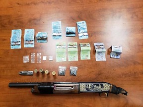 The shotgun, drugs and currency seized by officers. (supplied)