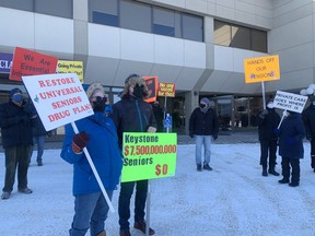 Protestors belonging to the group Strathcona County Fights Back gathered outside of local MLAs' offices at noon on Saturday, Feb. 13. Many said they were 'broken hearted' by UCP broken promises. Lindsay Morey/News Staff