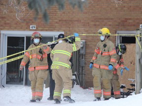Fire officials have begun their investigation into an overnight fire that killed one person at a townhouse on Arbour Glen Crescent in northeast London Thursday. (JONATHAN JUHA/The London Free Press)