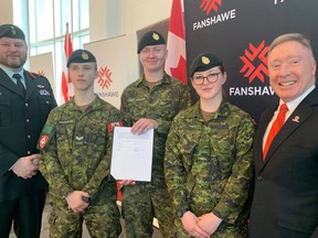 A new agreement between Fanshawe College and the Canadian Armed Forces is designed to make the college "military connected." From left Col. Jason Guiney, Corp. Bartek Malinowski, Pte. Garrett McFadden, Pte. Renee White and Fanshawe president Peter Devlin. (Heather Rivers, The London Free Press)