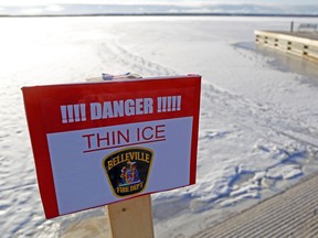 A Belleville Fire Department sign warns of thin ice on the Bay of Quinte Jan. 20. Prince Edward OPP announced Feb. 22 much of the ice in the area remains unsafe; a vehicle broke partially through the ice Saturday.