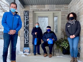 John & Joyce McDonald (Centre) of Teeswater receive their care packages which were safely dropped off
on their porch by Steve Travale, Communications/Public Relations Officer for the Municipality of South Bruce (L) and Becky Smith, Regional Communications Manager for the NWMO (R).