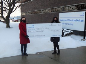 Imperial Oil’s Tracy Ardiel (left) presents a cheque for $40,000 to Noelle’s Gift’s Nicole Paquette, money that will be used to support the Ontario Student Nutrition Program-Lambton. 
Carl Hnatyshyn/Sarnia This Week