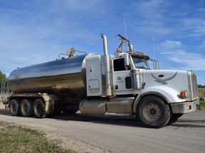 A water truck prepares to turn onto Northland Drive after filling up at the water treatment plant in Conklin, Alta. on Monday, Sept. 11, 2017. Cullen Bird/Fort McMurray Today/Postmedia Network