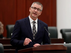 Travis Toews delivers the 2021 Alberta Provincial budget at the Alberta legislature in Edmonton Thursday Feb. 25, 2021.