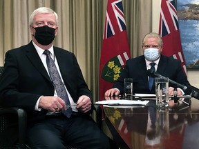 Ontario Premier Doug Ford and Retired General Rick Hillier, chair of the COVID-19 Vaccine Distribution Task force, inform Ontarians that Health Canada has approved the AstraZeneca COVID vaccine before speaking with all of Ontario's 444 mayors on a conference call at Queens Park, Friday. Jack Boland/Toronto Sun/Postmedia Network